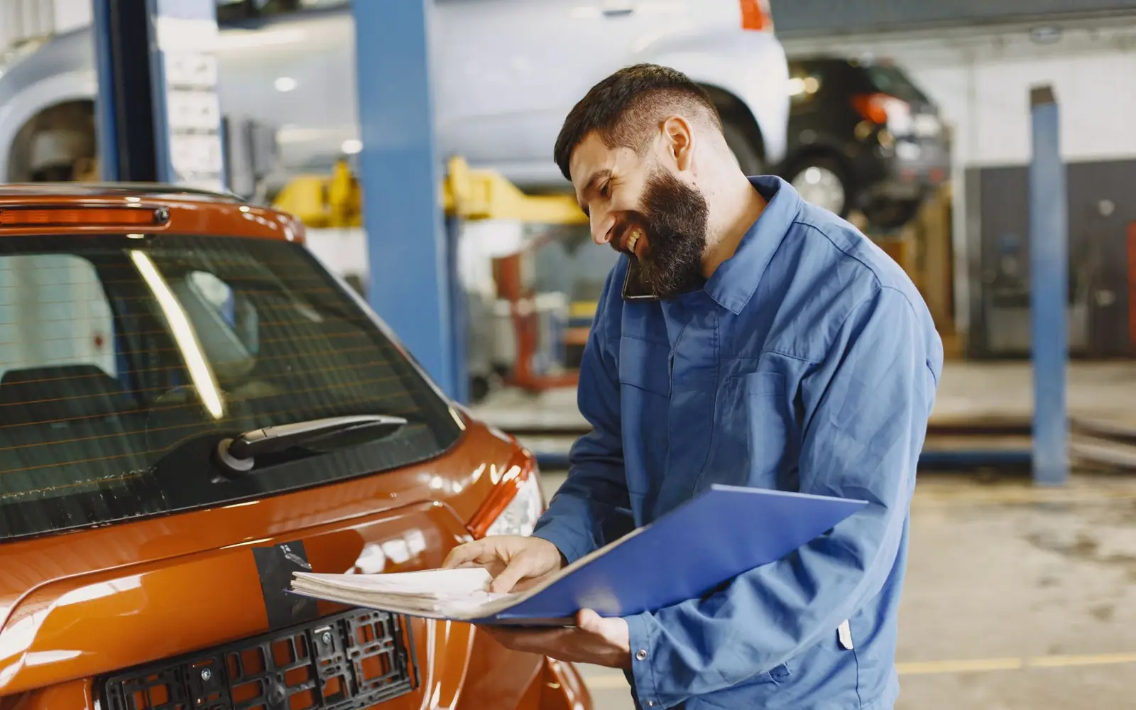 Technician with a customer's car